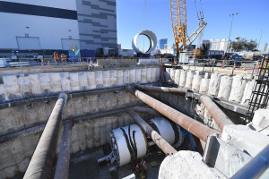 Workers from the Boring Company guide the third of three parts of the drill which will make the tunnel for the People Mover which will connect convention halls as part of the LVCCD Phase 2 construction in the Red Lot east of the south Hall at the Las Vegas Convention center Tuesday, October 29, 2019. (Sam Morris/Las Vegas News Bureau)